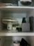 Cabinet with content, coffee maker, electric kettle, hob etc.