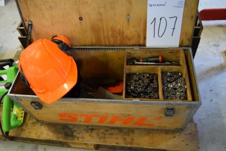 Box with various accessories for chainsaw