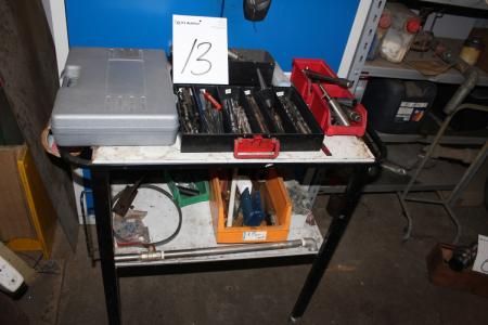 Rolling table with miscellaneous drills, rivals, cutting tools + acu screwdriver without charger