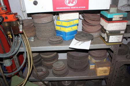Rack of contents of various cutting discs for angle grinders