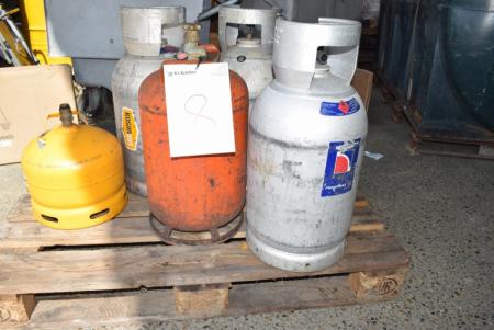 Pallet with gas cylinders. Contents of one bottle