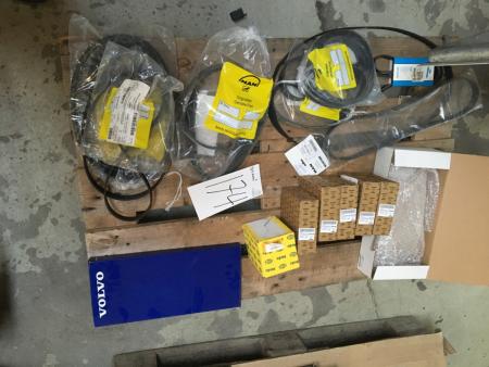 Various drive belts and various spare parts.