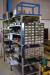 Steel Shelving with div. content div. Screws, chains, bolts and 4 pcs. assortment boxes with content. Air hose not included