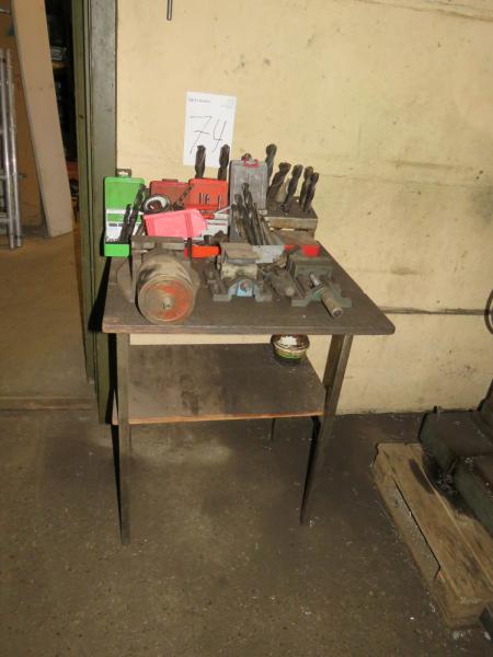 Table with various tables and machine screws.