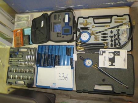 Pallet with various drills, petrol pressure tester, socket sets, etc.