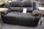 2 pers. Black leather sofa with built-in footrest
