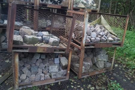 5 cages with various granite stones.
