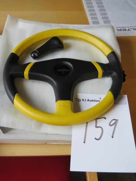 Rubber steering wheel with gear knob.