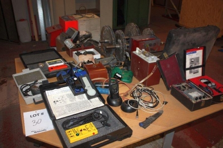 Table with various measurement instruments and more