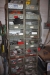 Vice bench with drawer + tool cabinet + assortment rack with steel drawers containing electrical parts