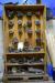 Bookcase with various router bits, spacers, etc.