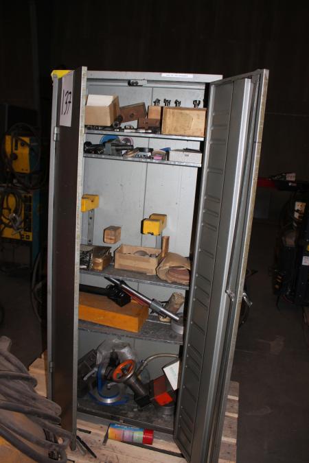 Steel cabinet with parts for lathe.
