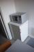 Container with electric heater, refrigerator, microwave oven, shower, toilet and changing cabinets