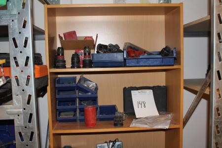 Bookcase with various accessories for drills