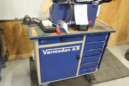 Tool rolling table with screwdriver and contents in cabinets.