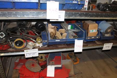 Various spare parts for lawn mowers on the middle shelf