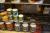 Bookcase containing various paint, all paint bowls on top shelf are empty the rest is ok. Everything must accompany.