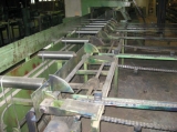 Planing line (profiling planer) including: destacker from packer with destacking of packages from two positions, Dimter no. 89257, Komm. 6506/1, Year of Manufacture: 1995. To lift no. 1 (8T) via (4) angle sprocket conveyors. To lift no. 2 (8T) via driven roller conveyor (komm. 6503/2, 1.5 meter. Joulin double vacuum yoke on gantry covering both lifts, destacker subjects on (7) elevation jibs, angle transport with straps to angle sprocket conveyors with bars for separation, angle sprocket conveyors, driven roller conveyor with driven overhead pressure wheel for planer feeding; four-side planer, Kupfermühle, 400 x 100 mm, Year of Manufacture: 1984. 7 meter runout conveyor with tilter for placing on (6) angle sprocket coveyors with bars Dynagrade stress grading system; driven conveyor. Dimpter cross cut line consisting of driven infeed from planing line; angle sprocket conveyors for separation, infeed conveyor for saw; Dimpter saw, inclined waste conveyor with push bar conveyor with additional angle conveyor for waste; colour spray for stress grade printing; 19 meter driven roller conveyor, (2) angle sprocket conveyors for grading profiles in inner and outher profiles. Driven roller conveyor, length app. 21 meters (Dimpter 89257, komm. 6506/10, Year of Manufacture: 1995. (7) angle sprocket conveyors with push bars. Lifting system for elevation of subjects to roller conveyor. Driven roller conveyor: 15 meters in front of finger joint machine. Finger joint milling machine (HK 400L, 1995, 10-6506, 10kW) with gluing unit. Driven runout roller conveyor. Angle sprocket conveyor with (7) chains. Roller conveyour with infeed unit. Dimpter press. Dimpter cross cutter. Driven runout belt conveyor. 37 meter driven runout roller conveyor with overhead pinch roll. Optional left / right destacking