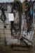 Various cables, hoses, hoists on the wall and more
