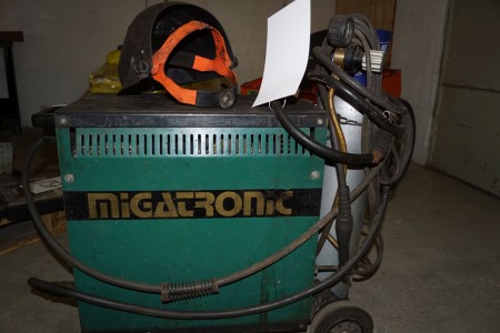 Migatronic Automig 185 with owner bottle and welding helmet.