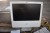 Apple PC screen with keyboard and mouse