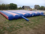 Bouncy cushion, approx. 10 x 10 m, working properly, holding pressure, full service book included