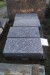 A piece of polished granite tile L: 61 cm. B: 30.5 cm T: 10.5 cm.