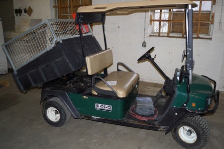 Electric car with tipping trailer labeled: EZGO MPT, with electronic charger and good batteries L: about 310 B: 125 H: 118 cm