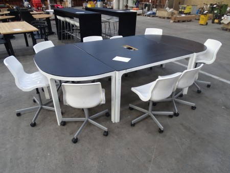 Conference table, with center cut to projector. 9 chairs. 282x140x73.5.