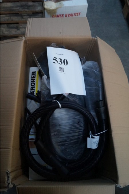 Box with various hoses and heads for vacuum cleaners.