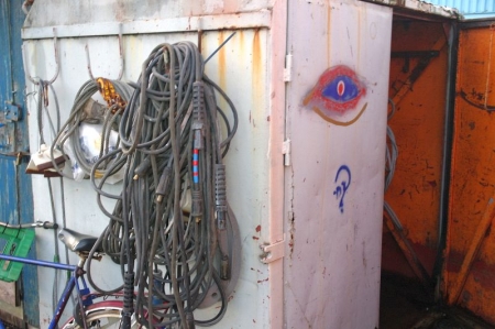 Tool Shed with content:: steel wire and welding cables on wall