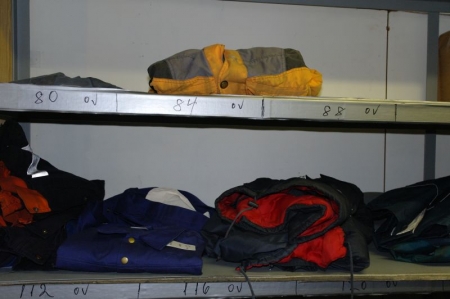 Lot clothing + rainwear in steel rack + approx. (5) clean air masks + (2) security filters, and batteries for Tornado clean air masks + content in the steel shelving (clean air masks and spare pig hammers, etc.)