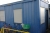 Crew container, 20 feet. Insulated. Light, heat. CTX CONTAINEX. Windows with aluminum shutters in side wall. Door in end wall