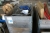 (9) pallets with various lifting equipment: steel wire ropes, chains, shackles + blades for band saws (3) boxes m. (2) foot operated hydraulic pump + 2 hydraulic jack + sheet metalclaws. Work Lamp, vice