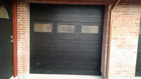 Roller door in black exterior, still unused in wrapping h: 2375 cm b: 2450