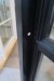 Facade door section, wood, black / black, H212xB145.5 cm, frame width 11.5 cm. Has been mounted