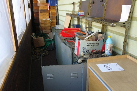 Various steel cabinets with contents along the wall
