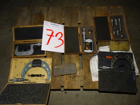Pallet with various micrometer measuring tools.