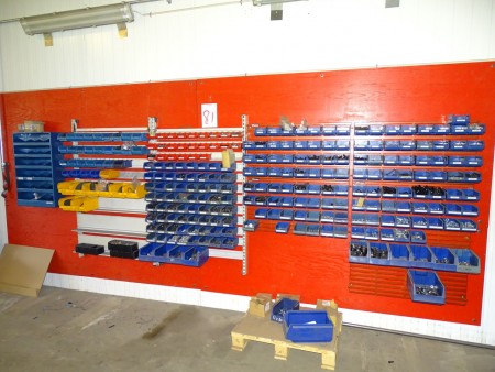 Assortment shelving on wall. With content red plate not included.