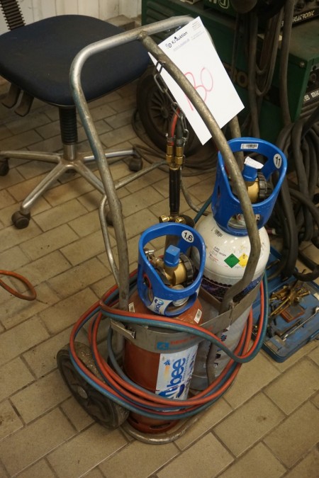 Oxygen and gas burner set with equipment on cart.
