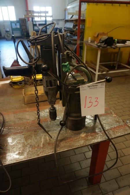 Magnetic drill stand with drill.