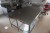 Freestanding stainless table with various pots etc. under table 120x200x90 cm