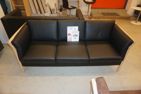 Three-seater sofa. Leather beech. Width: 194 cm.