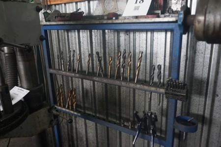Stand with various drills, welding pliers and more.