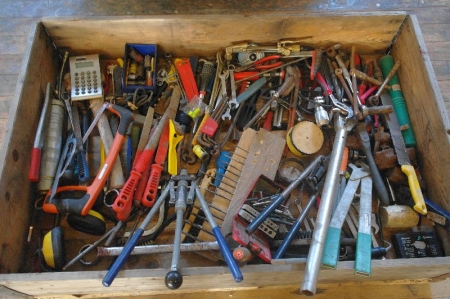 Pallet of various tools. Drill, file, screwdrivers, Allen keys, etc.