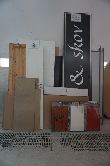 Lot of various signs, doors, partitions and display board.