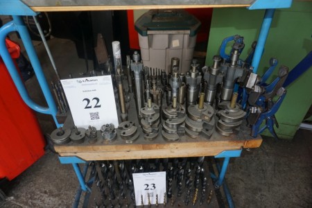 Content on shelf in carriage various drills, milling cutters, etc.