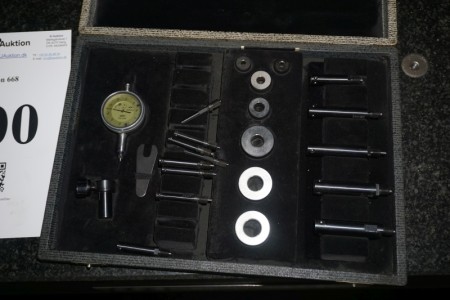 Somethe depth meter with various tools.