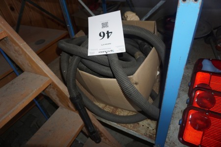 Box with vacuum cleaner hose.