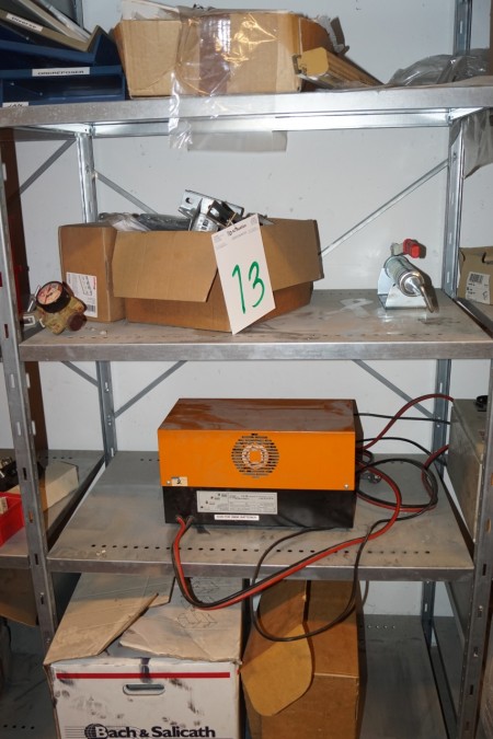 Content in 1 compartment steel shelf of different trucks Charges FN Elektro etc. + Various power trays 380 volts 32 amp plugs in top.